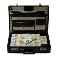 Black briefcase with compartments and stacks of money on a white background