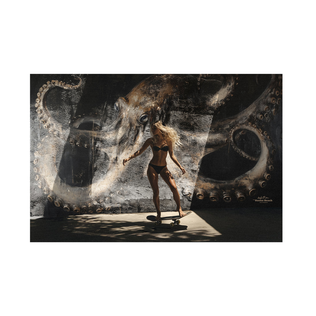 woman skating in california in front of a octopus mural art