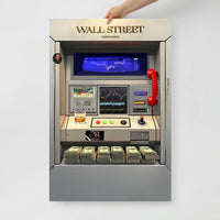 An artistic representation of a Wall Street themed arcade machine with a red telephone and digital display.