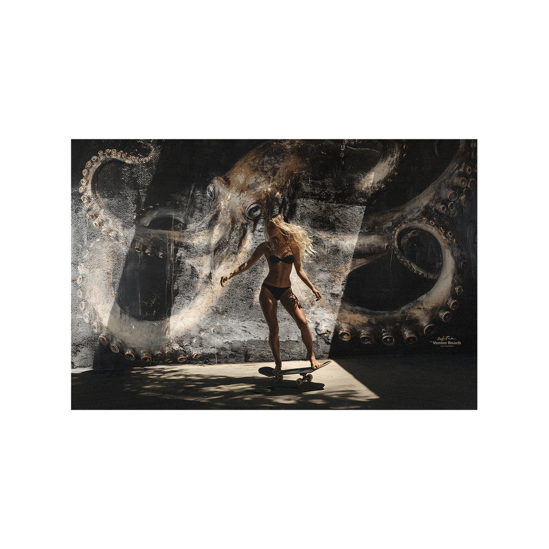 woman skating in california in front of a octopus mural