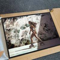 unboxing of a black frame art piece featuring a woman roller blading in front of a mural