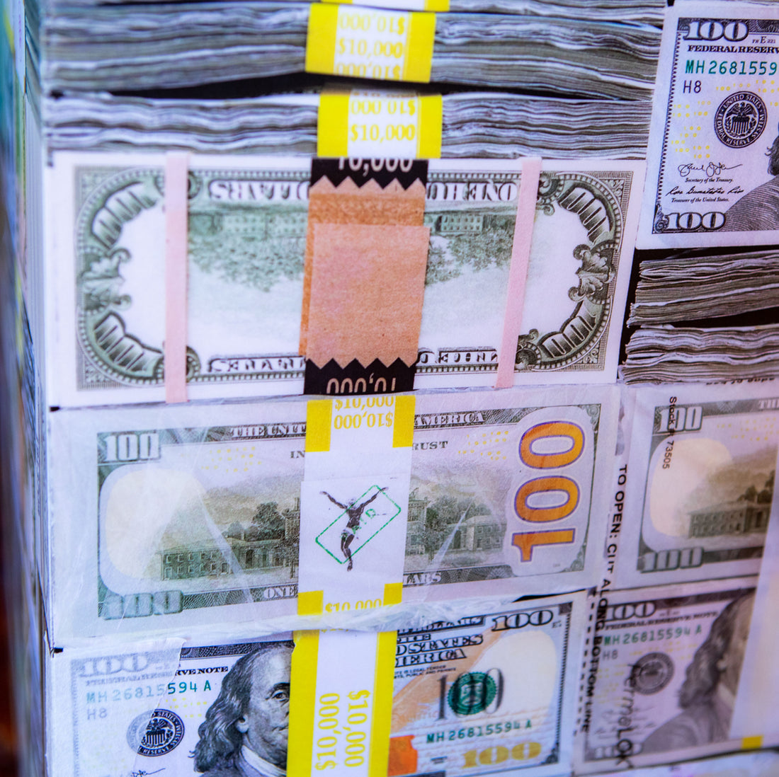 side view of stacks of money with sticker bank straps