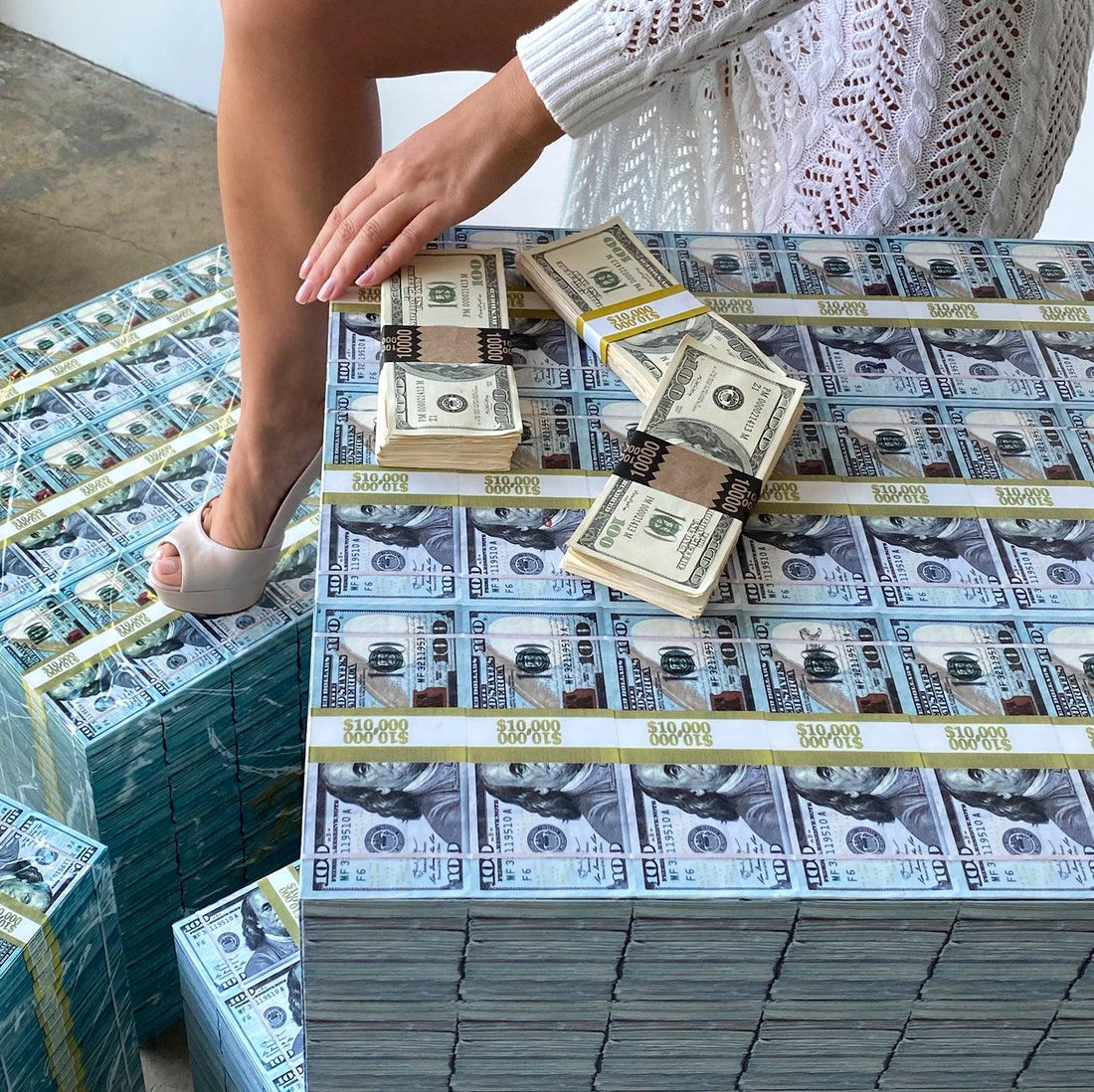 woman shoes over a square money table and prop money