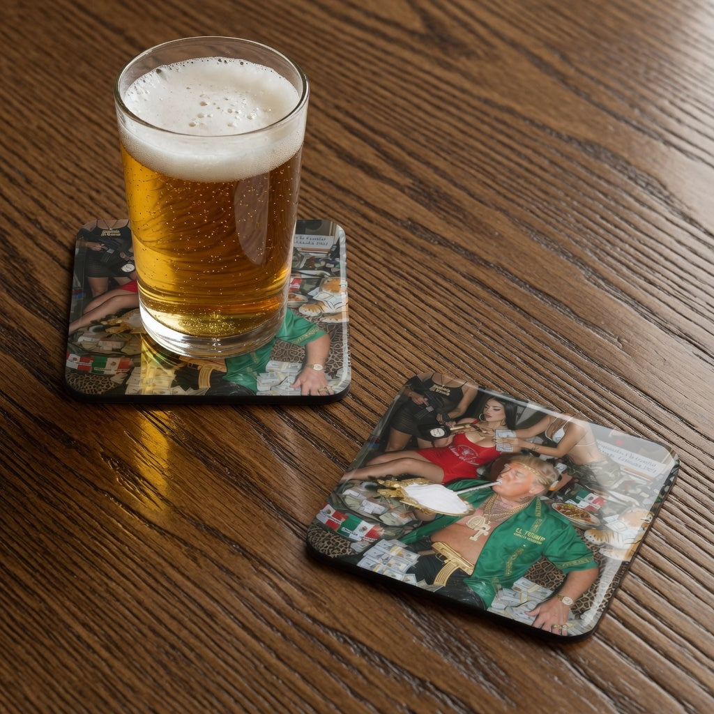 Glass of beer on a wooden table with two coasters featuring trump funny