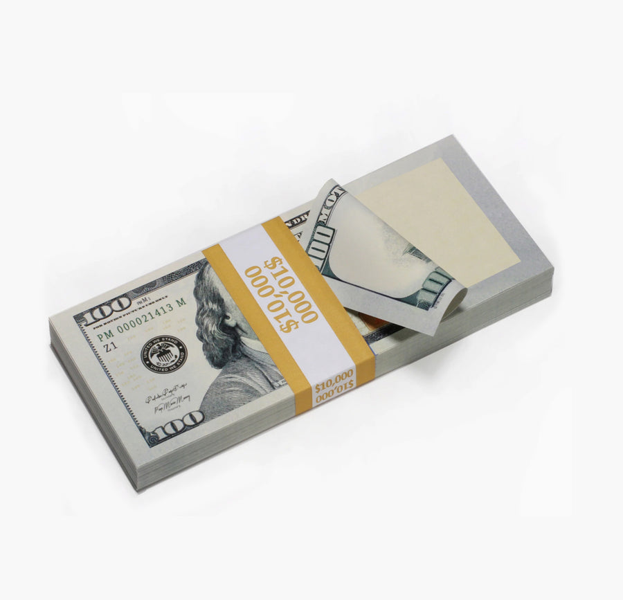 Stack of U.S. hundred-dollar bills with a yellow ribbon on a white background