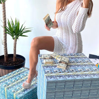 woman with white dress and money tables 
